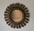Vintage French sunburst mirror. This sunburst wall hanging mirror features gilt "rays" coming out of a central round...