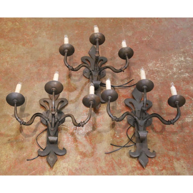 Bring timeless architectural character to a hallway, great room, or wine cellar with this striking set of three antique...