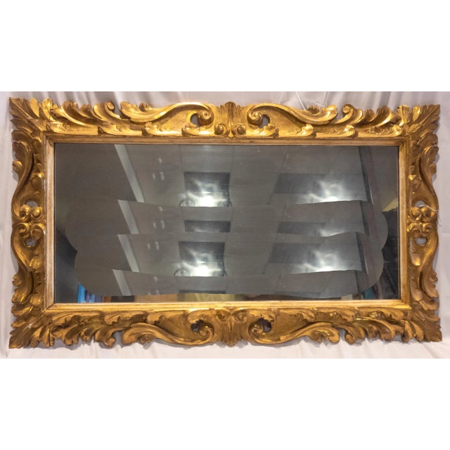 We are selling this very nice 19th century Italian carved giltwood Florentine frame with mirror. Condition: Good condition...
