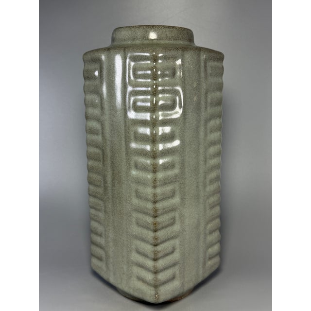 Beautiful Chinese Longquan celadon cong‑style square vase, featuring traditional raised geometric relief patterns across...