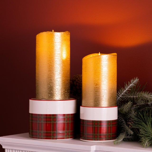 Add a warm and cozy touch to your holiday decor with this charming set of Plaid Ceramic Candle Holders. Featuring a...