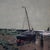 An antique seascape offers watercolor scene of shoreline with fishing boats and figures, artist signed lower left as...