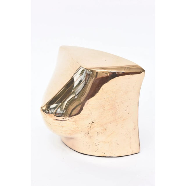 This wonderful cast bronze French abstract sculpture is a single breast. It is signed and numbered 100. The signature in...