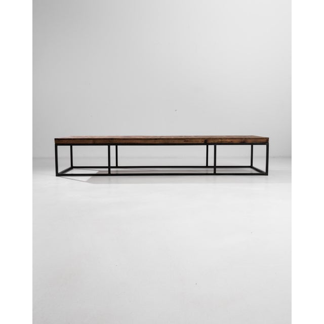 This minimalist coffee table presents an alluring geometry, its steel base divided into three parts make a balanced...