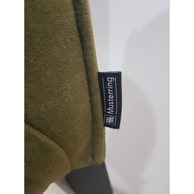 A pair of beautiful olive-colored chairs from the renowned German brand Musterring. Produced in the 1980s. The model is...