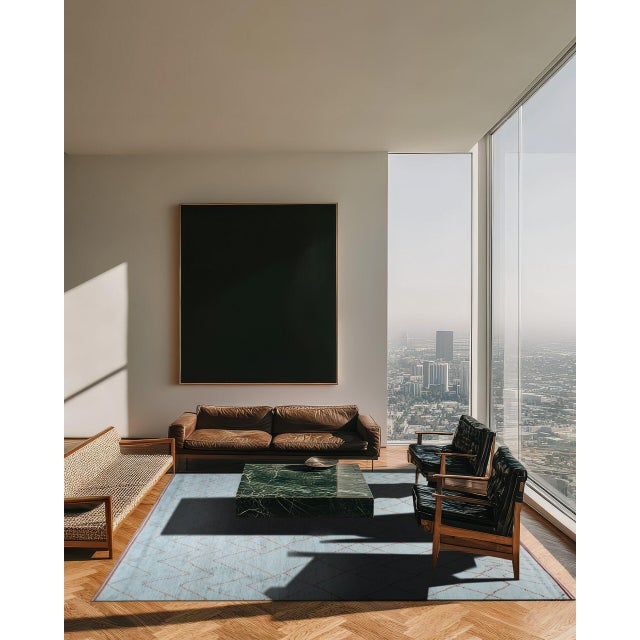 Isla Moroccan Blue Hand Knotted Wool Rug, Country of Origin: India. This exceptional piece merges the plush texture of...