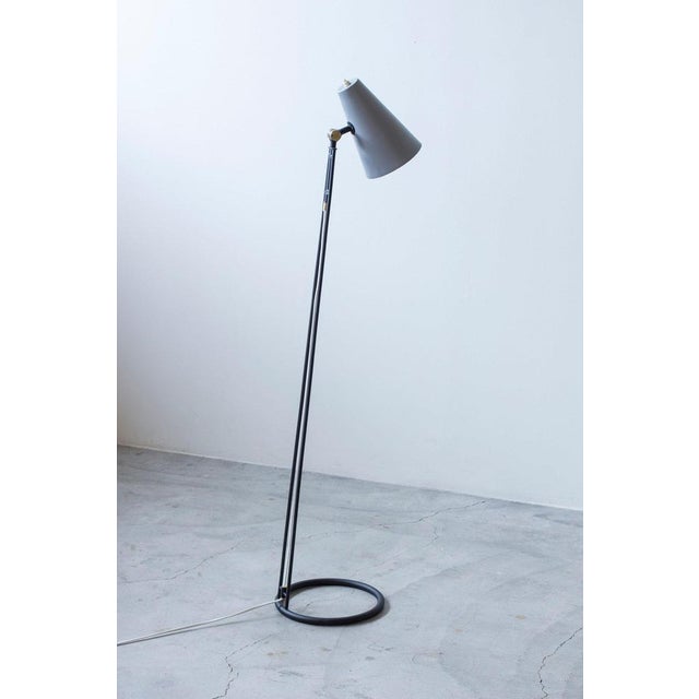 Floor lamp designed by eje ahlgren. Produced in sweden by luco during the 1950s. Made from black lacquered steel with...