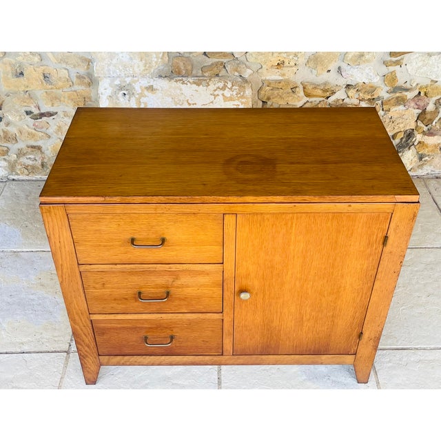 Vintage, oak storage cabinet with drawers circa 1950s piece is made of wood and has golden oak veneer finish. it has a...