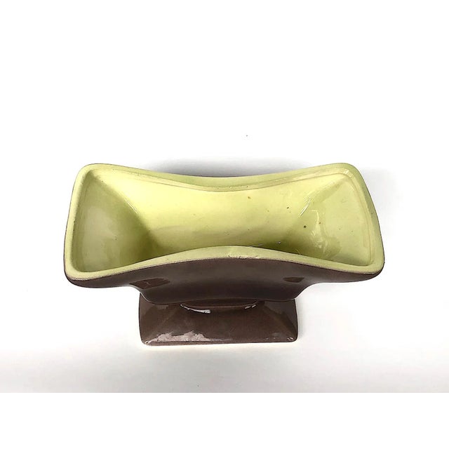This vintage mid-century modern pottery planter has a classic brown and yellow-green two-tone color combination. Designed...