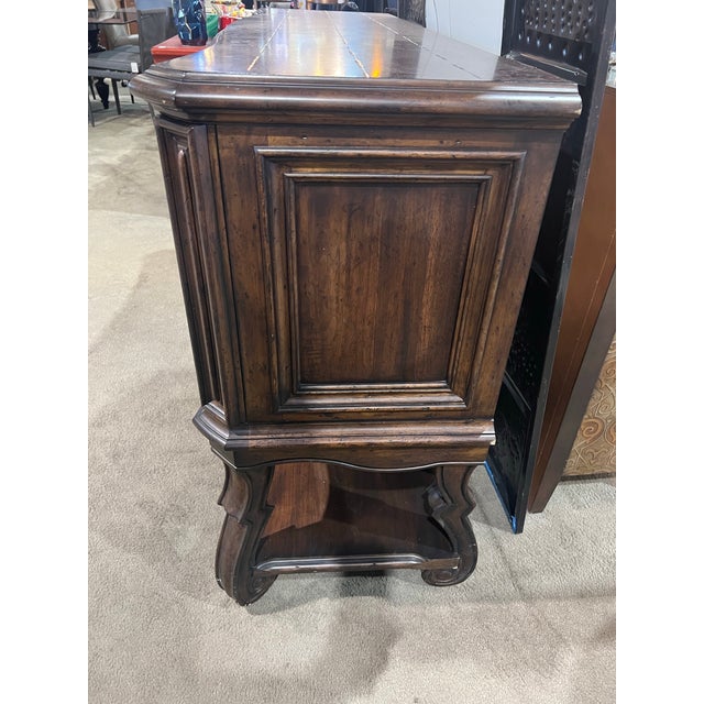 Elevate your dining or living space with this beautifully crafted Rustic Buffet by A.R.T. Furniture. Designed with a...
