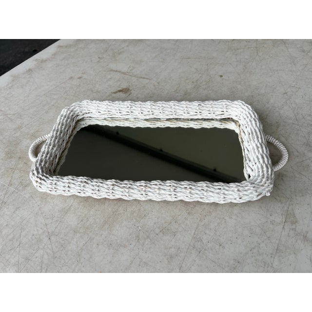 Bring effortless coastal charm or curated bohemian style to your space with this vintage 1970s–1980s white wicker mirrored...