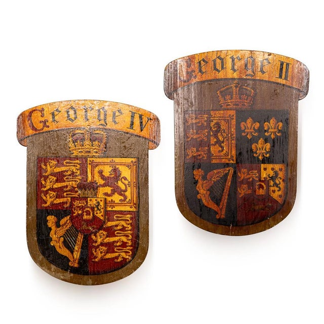 Antique 18th century english hand painted heraldic plaques, each formed as a shaped oak shield and decorated with royal...