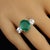 Introducing the Magnificent 6.46-Carat Brazilian Emerald Dinner Ring – a stunning statement piece that is sure to turn...