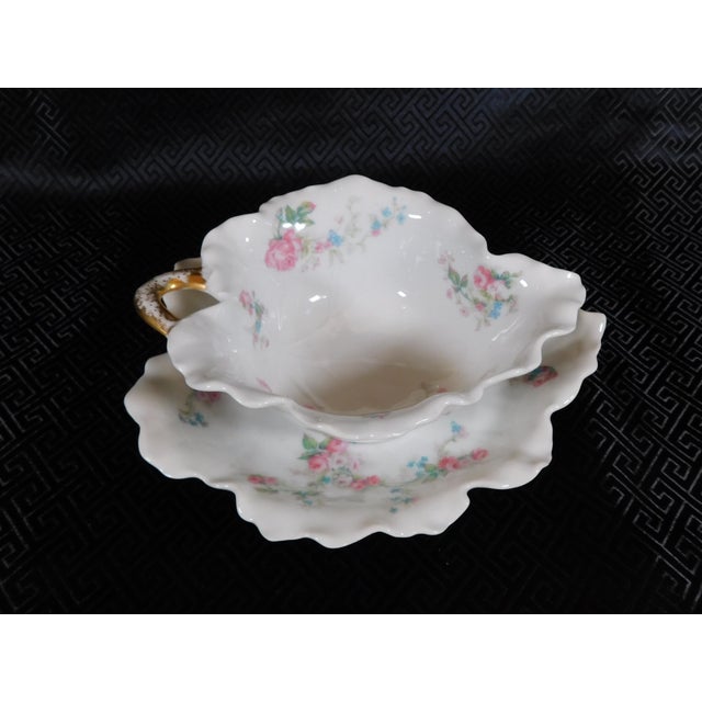 This is a white Haviland bowl and underplate or gravy boat set. The set is white with pink flowers, no trim color and a...