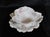 This is a white Haviland bowl and underplate or gravy boat set. The set is white with pink flowers, no trim color and a...