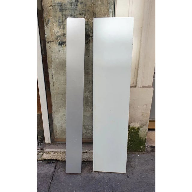 Charlotte perriand pair of shelves "the arcs 1600" circa 1965 size 1: l34 x h147 x d4.5 cm (metal lacquered white) size 2:...