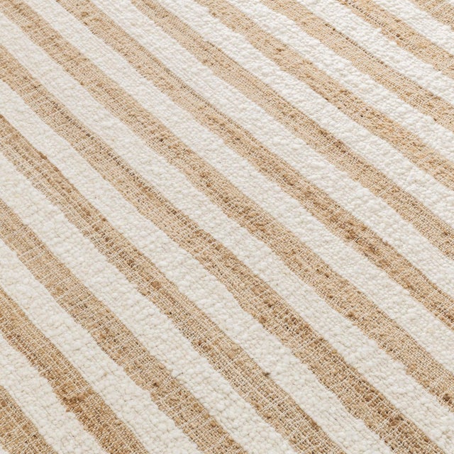Natural jute and ivory wool classic striped rug. Perfect in a wide variety of interiors including coastal, contemporary,...