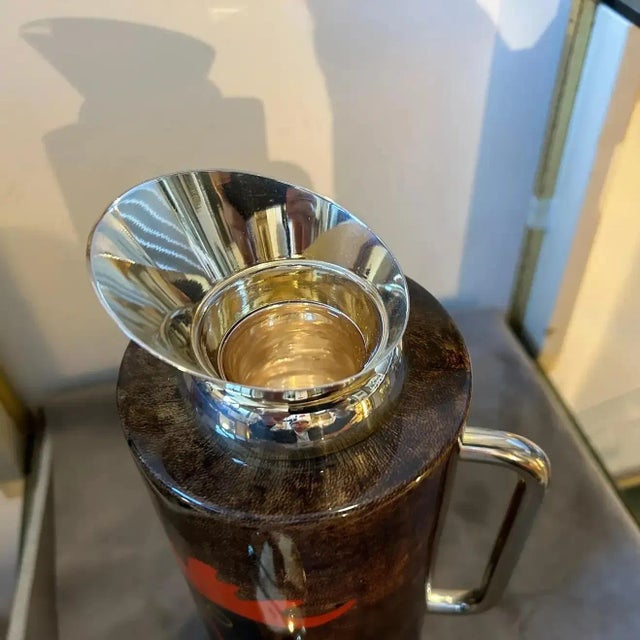 A 1950s Mid-Century Modern brass and brown Goatskin Thermos Carafe designed by Aldo Tura and manufactured by Tura...