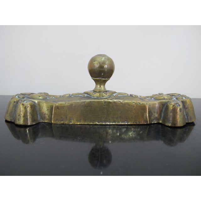 Antique Victorian style cast iron paperweight or door stop with thin brass or metal exterior. Measures 8 1/2" x 2 3/4" x...