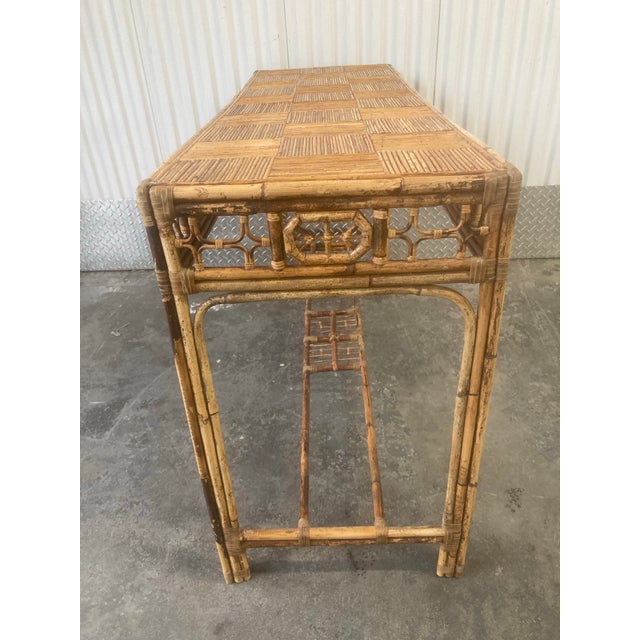 A very fine and well-constructed bamboo Chinese Chippendale style high sofa table or console table with fretwork pattern...