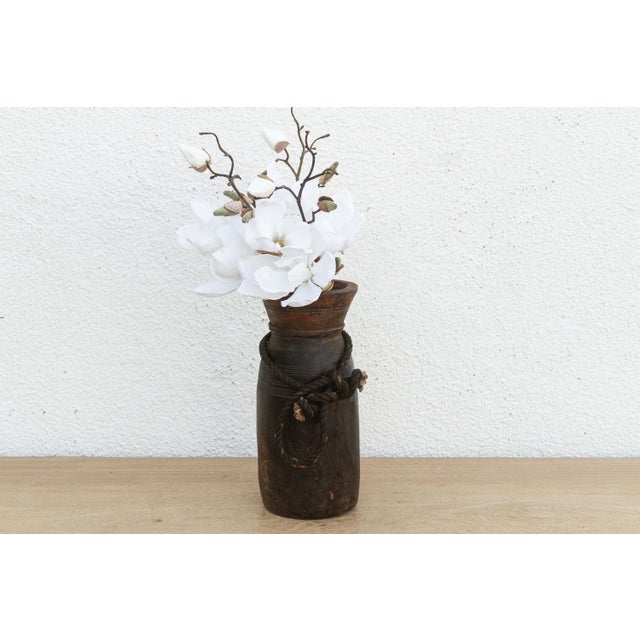 Originally used in village homes for storing milk, ghee, or grains, this antique wooden pot has survived generations of...