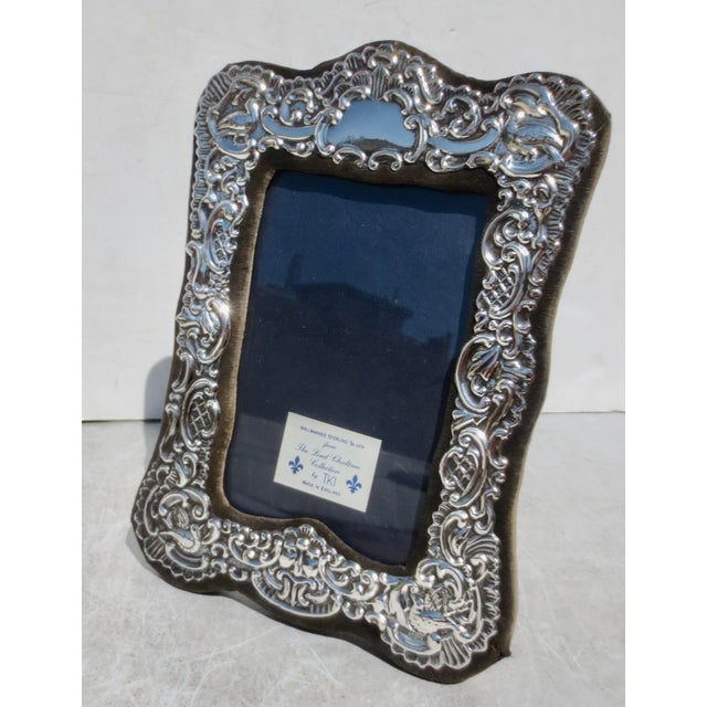 This TKI "Lord Chatham Collection Edwardian style frames with a bird design in each corner and bordered by cartouches ....
