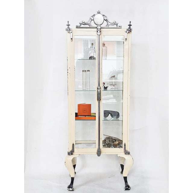 Empire style metal display cabinet. Original condition.