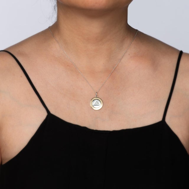 Stylish pre-owned Tiffany & Co rope necklace crafted in sterling silver and 18k yellow gold. The necklace is a retired...