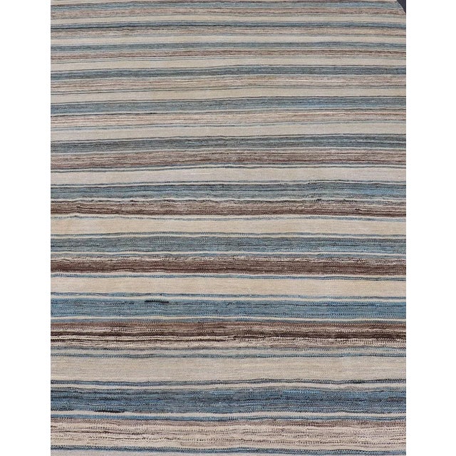 Versatile and natural blue, cream and brown flat-weave Kilim for a Modern or classic design. Flat-weave Kilim rug with...