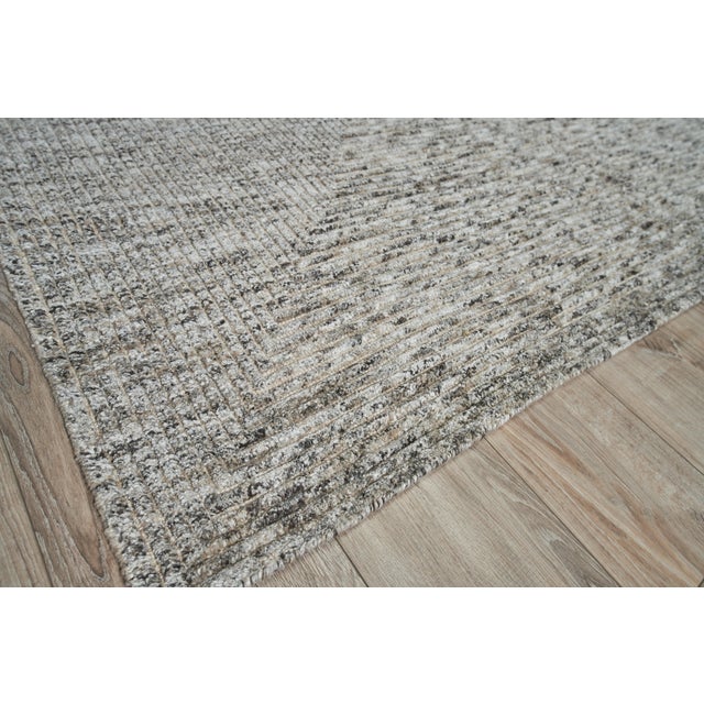 The Crescent rug takes its styling inspiration from classic modern geometric design. Our master weavers beautifully hand...