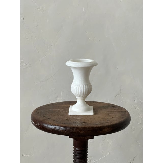 Small carved marble vase in a classical urn style. Well crafted and polished.