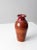 This is a vintage studio pottery vase. Signed by the artist, Mary Daly, the tall handmade vase has a rich maroon and...