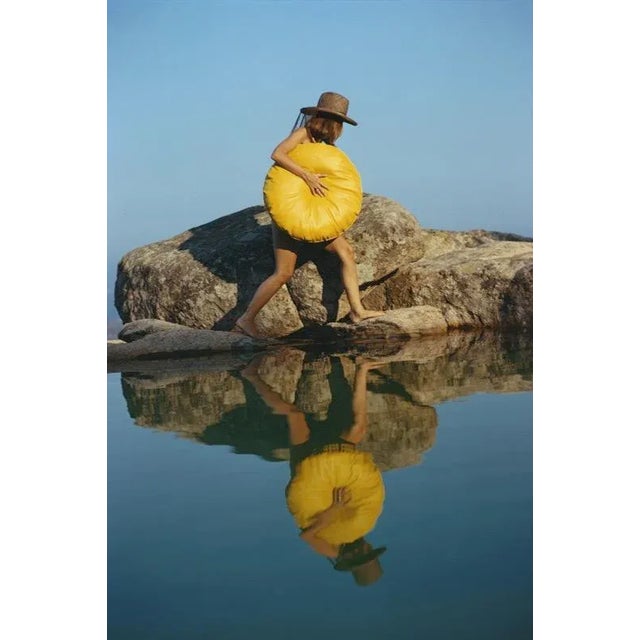 Finding a Spot 1973 A sunbather at the seaside-style pool of Jacques Couelle’s home ‘Monte Mano’, on the Costa Smeralda,...