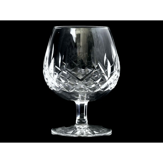 A handsome set of six authentic Waterford Crystal brandy snifters in the iconic Lismore pattern. Beautifully cut with...
