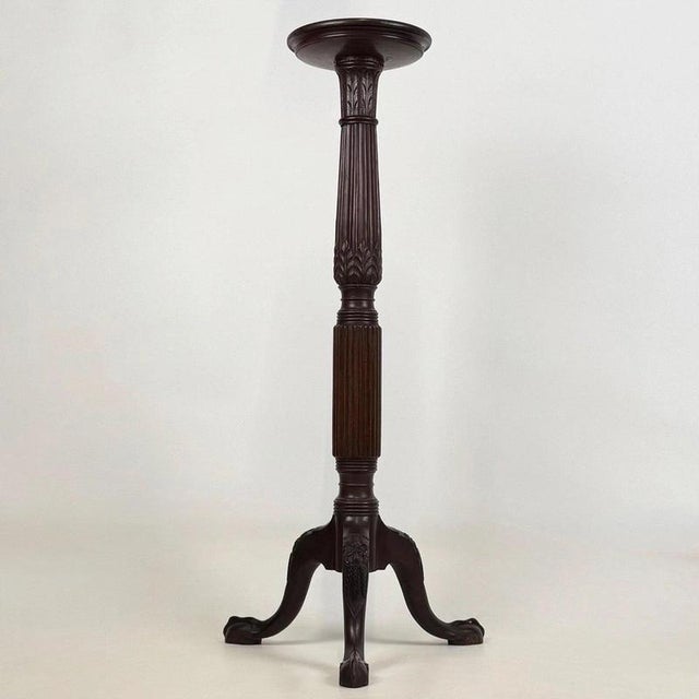 A beautifully crafted 19th-century English Victorian plant stand, finely constructed in mahogany and distinguished by its...
