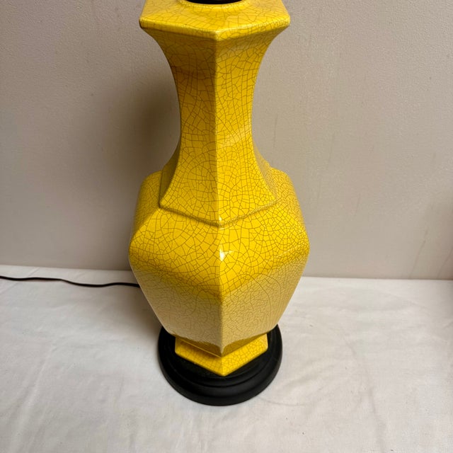 Brighten your space with this elegant vintage yellow crackle glaze table lamp. Its vibrant color adds a touch of warmth...