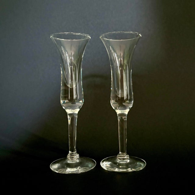 A refined set of two vintage cordial glasses by Holmegaard, the renowned Danish glasshouse known for its elegant mid-...