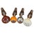 A distinctive vintage Mercedes-Benz wine accessory set featuring four bottle stoppers designed to resemble classic...