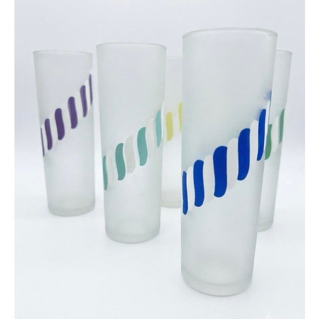 This set of 6 Hazel Atlas glasses, shown features a distinct mid-century modern design. The glasses are characterized by...