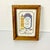 This is a fun little Americana Cross Stitch Folk Art piece that’s framed in an Oak wood under glass. It makes a cute...