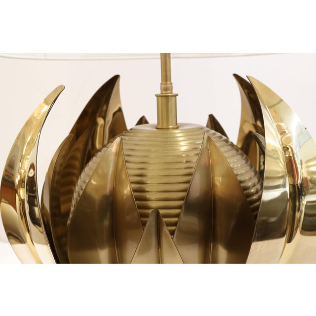 Single Italian Mid-Century brass table lamp. Central patinated brass sphere with horizontal banding details surrounded by...