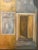 A tall, richly textured modernist painting of a gabled yellow house with a dusty blue-grey roof, set against a deep olive-...