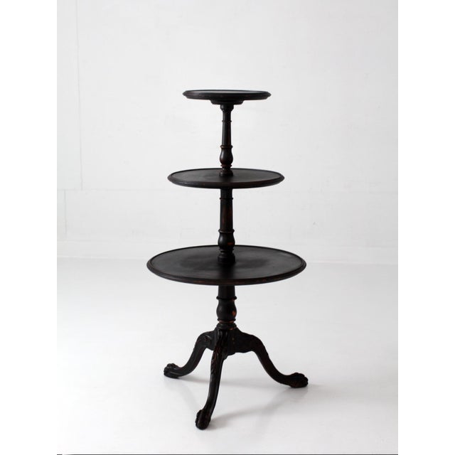 Antique Victorian Three-Tier Stand with Turned Column and Claw Feet. This elegant tiered stand features three round...