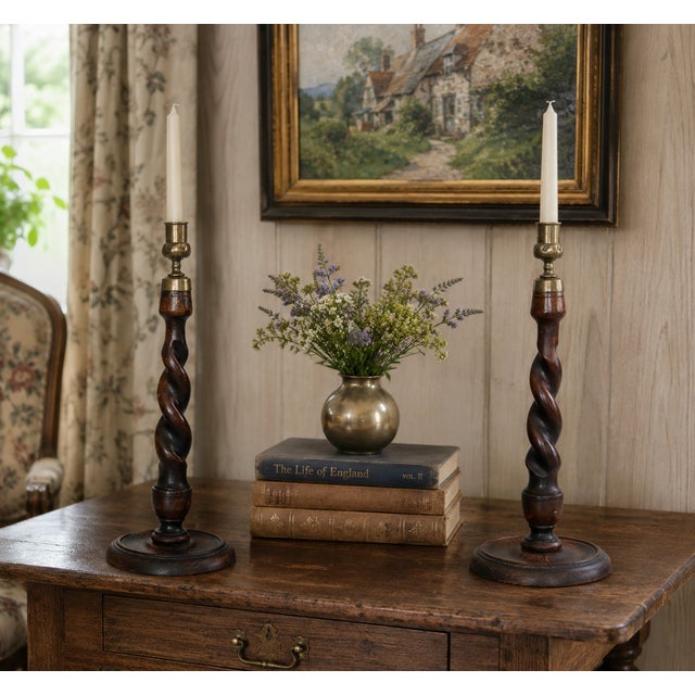 A fine tall 14.5" pair of antique English barley twist oak and brass candle holders, circa 1910. This gorgeous pair have...