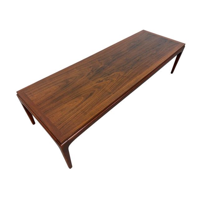 Elevate your living space with this 1960s Lane Mid-Century Modern walnut coffee table. Showcasing rich walnut grain,...