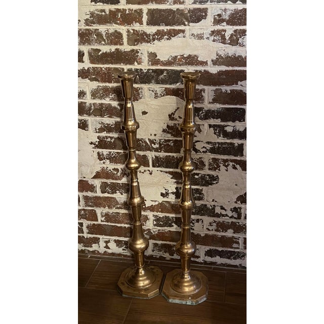 Gorgeous brass floor standing candle stick holders. Brass needs a good cleaning on the bases. Other than that in great...