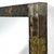 This striking 1968 wall-mounted mirror by Paul Evans is from his copper, bronze and pewter patchwork series. The hammered...