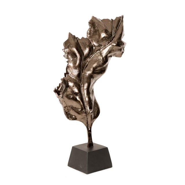 Inspired by natures organic forms, this sculptural leaf design features a rich metallic bronze finish that captures light...