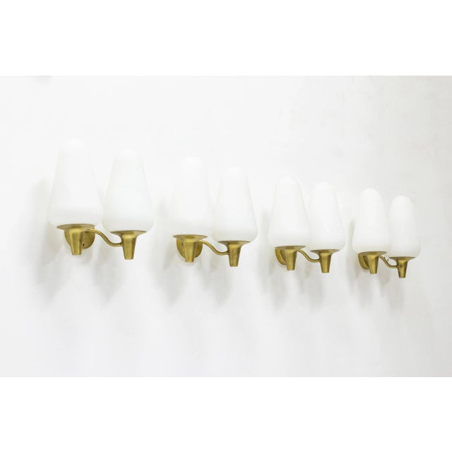 Wall lamps produced in Sweden by Böhlmarks lampfabrik. Made during the 1950s. Made from brass with original finish and...