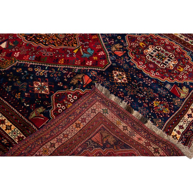 Beautiful Vintage Persian hand-knotted Wool rug with the blue field. This Persian rug has a multicolor accents in all over...